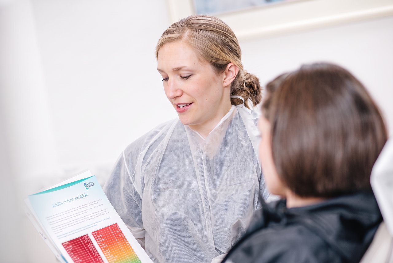 An adult patient receiving routine dental care at Hingham Dentistry