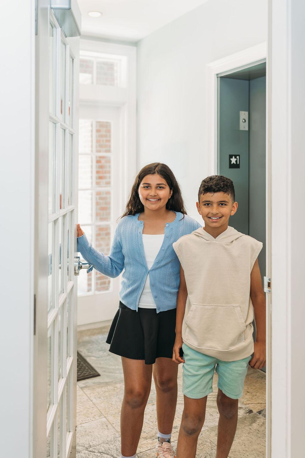 A Hingham Dentistry team member welcoming a new patient at the front desk